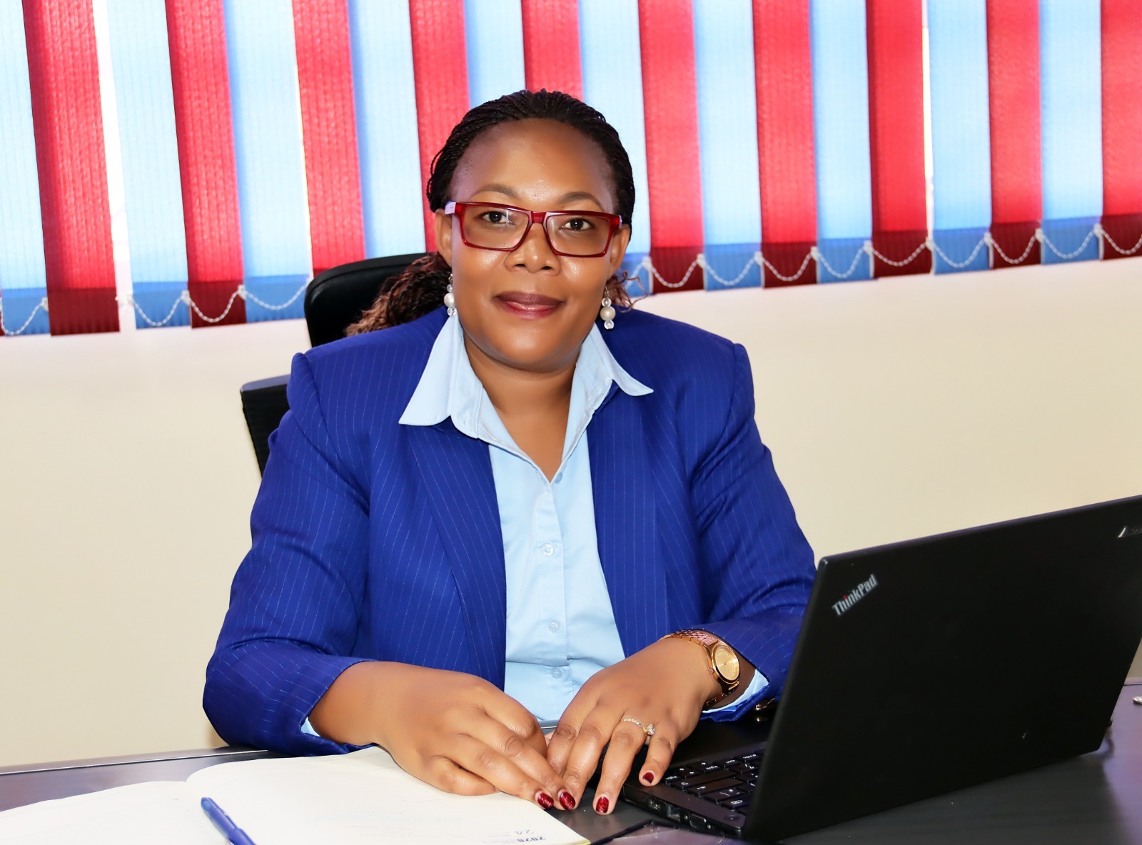 Makena Kinoti at her desk